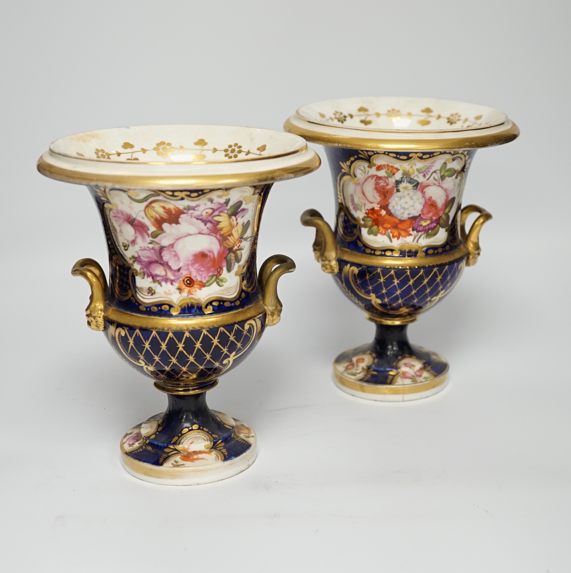 A pair of early 19th century English porcelain vases, scale blue ground, 19cm